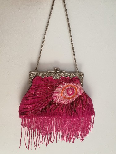 Butler wilson pink peacock - &,